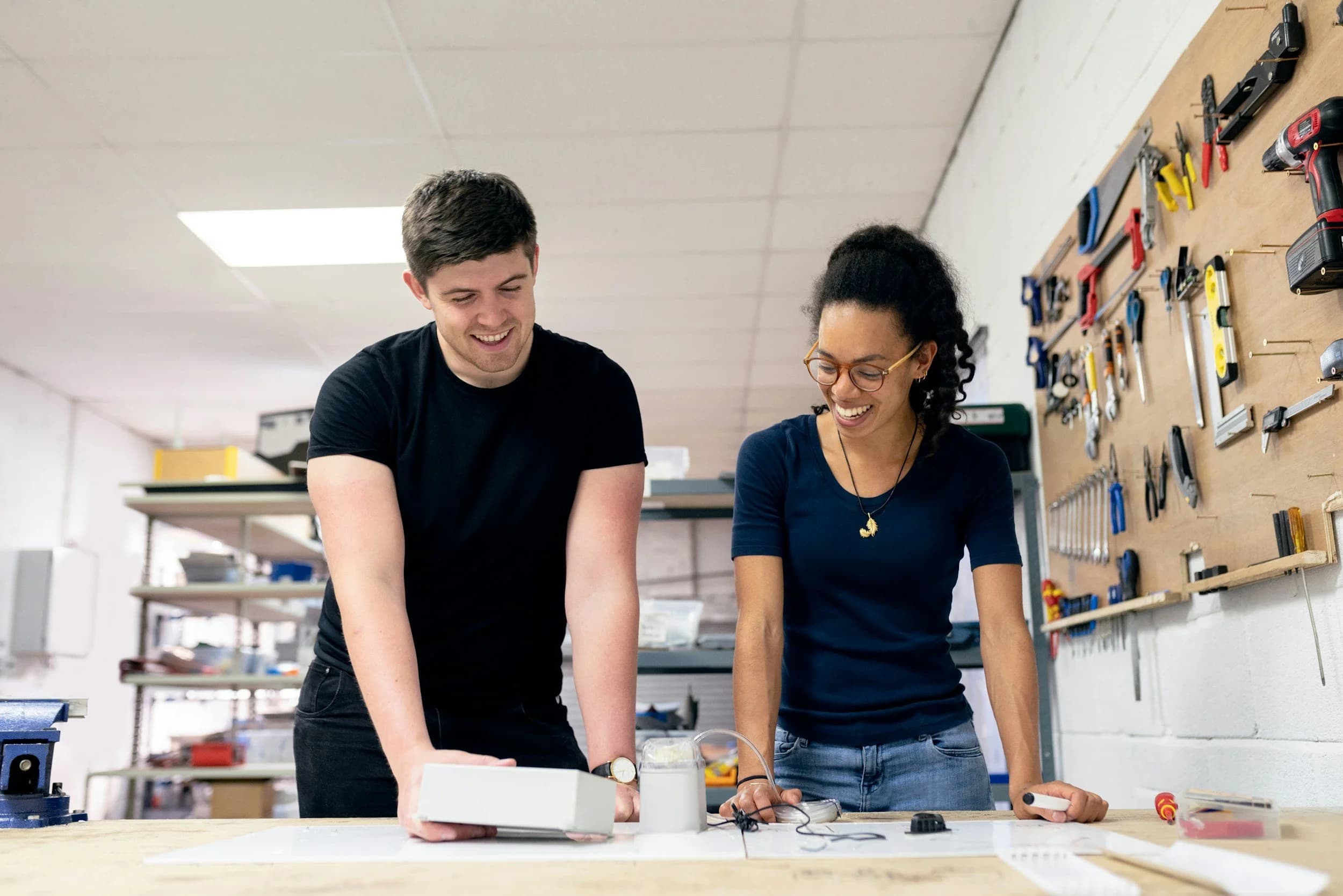 Two apprentices working together in a vocational training workshop in Germany