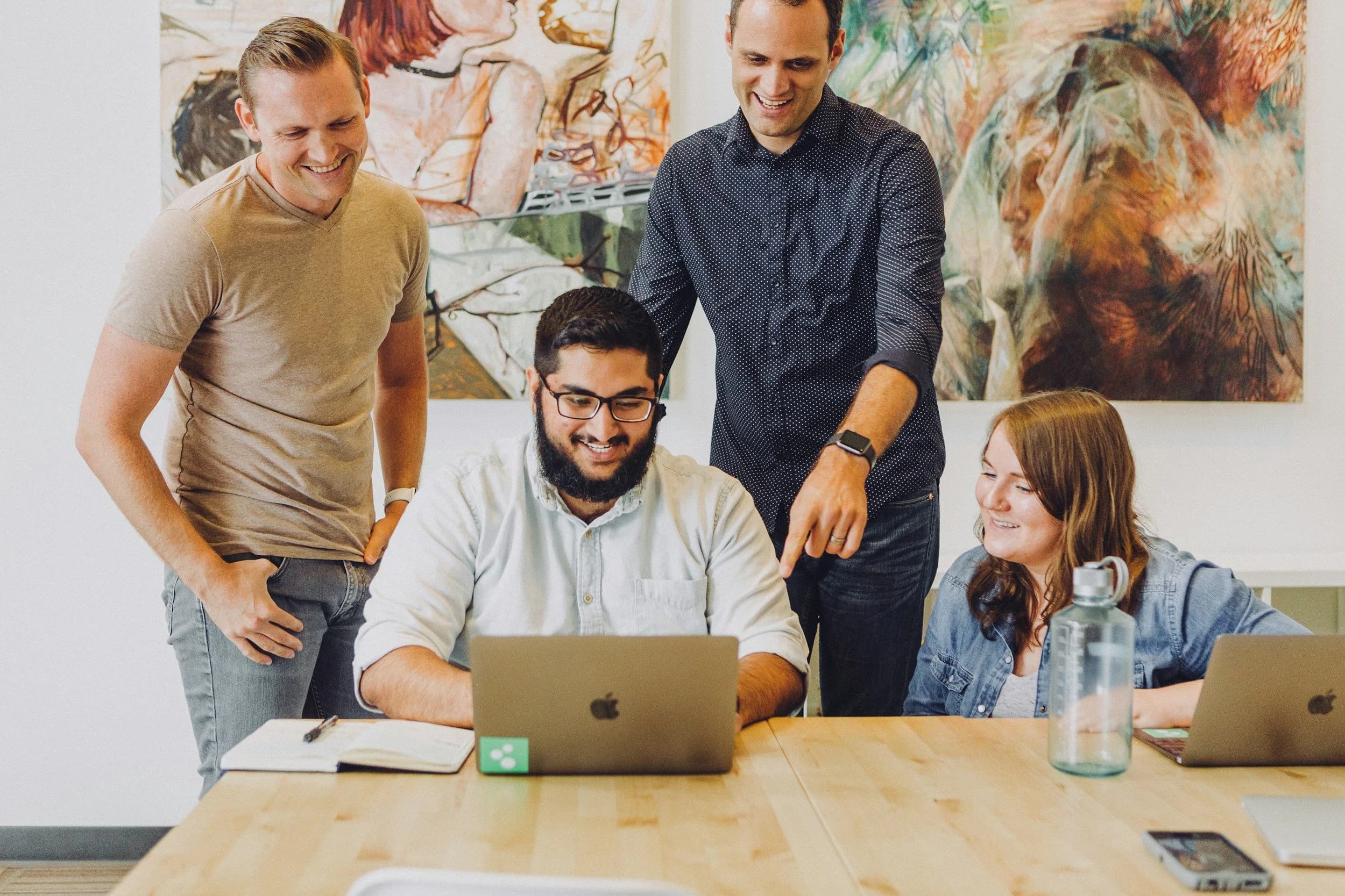 A diverse team of young professionals working together — the kind of career an Ausbildung can lead to