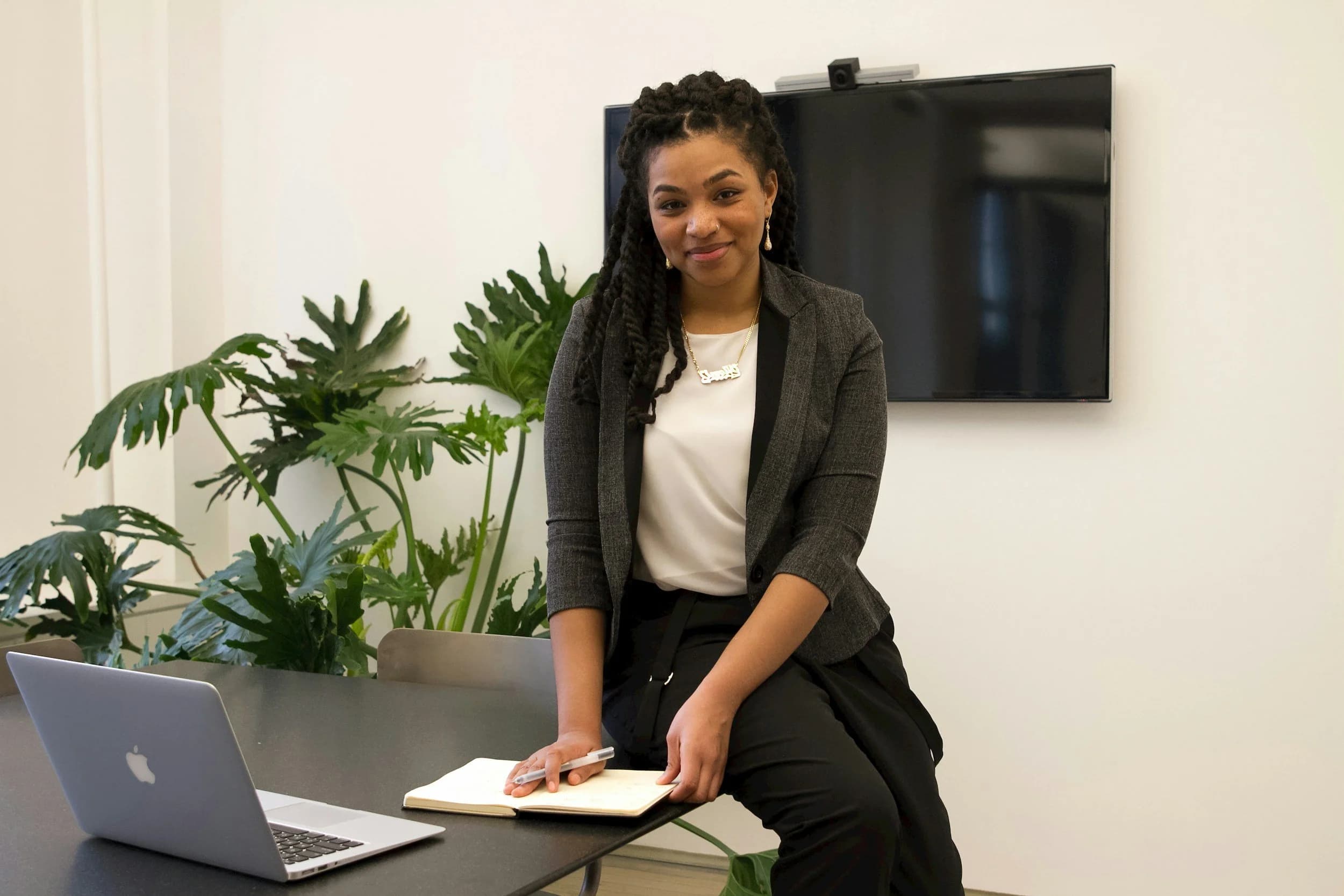 A young professional woman at her desk — the kind of career an Ausbildung in business or IT can lead to
